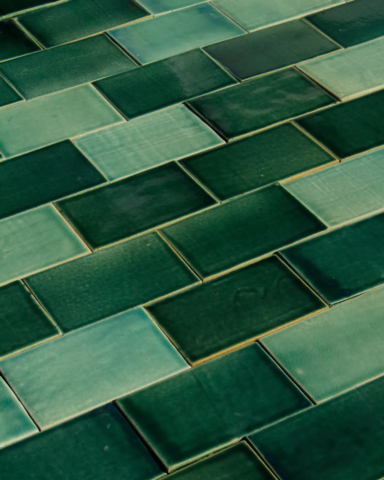 A close-up view of some handmade emerald green tiles.